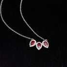 Three Pear Cut Created Ruby and Moissanite Halo Leaf Necklace in Silver - Rosec Jewels